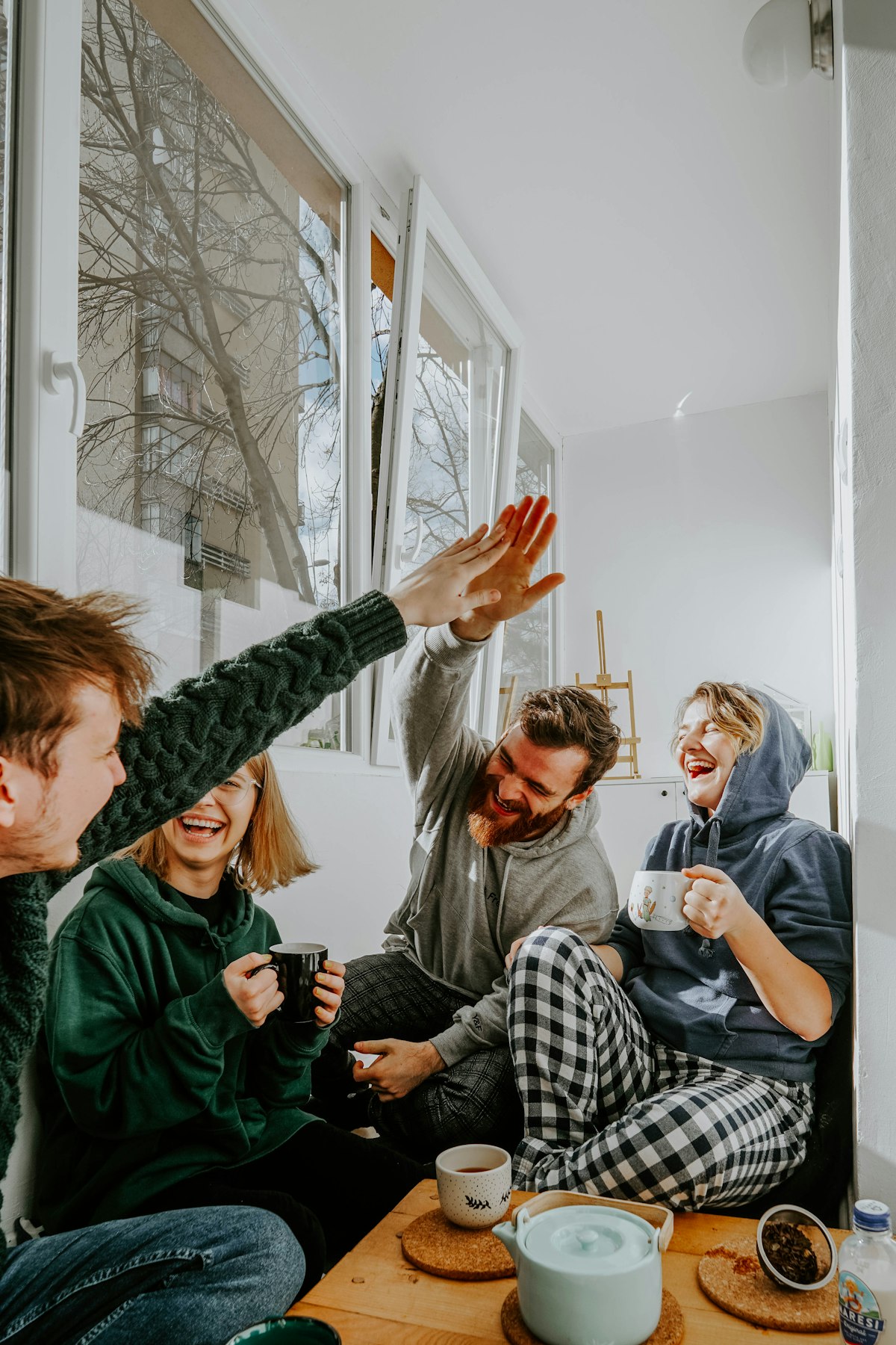 Friends laughing together at a SHAKE gathering